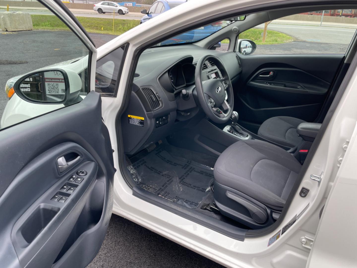 2014 White Kia Rio (KNADN4A35E6) with an 4-Cyl, 1.6 Liter engine, Automatic, 6-Spd transmission, located at 8008 Warden Rd, Sherwood, AR, 72120, (501) 801-6100, 34.830078, -92.186684 - Photo#12